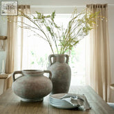 Rustic textured gray ceramic siena large brown amphora pot with two handles and ribbed surface