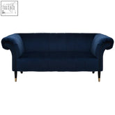 Deep navy blue velvet two seat sofa with rolled arms and gold nailhead trim in midnight blue velvet