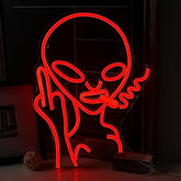 A glowing red alien neon light sign with large eyes and playful expression for wall decor and party vibes