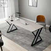 Modern gray sintered stone simon office desk with black x-shaped metal legs for a sleek office desk setup