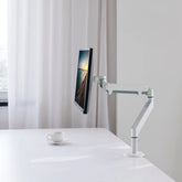 White single gas spring monitor arm holding a sleek modern display perfect for dual monitor setups