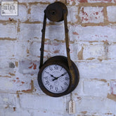 Sirtaul pulley style industrial wall clock with white face black roman numerals dark brown metal casing and rusty belt