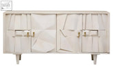 This modern off-white sideboard features four door whitewash mango wood with geometric panels and tapered legs