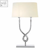 Chrome finished skye table lamp with cream fabric shade and twisted metal cross base perfect for stylish lighting