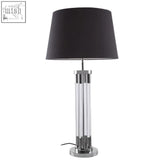 Black drum shade skye table lamp with sleek chrome and tubular acrylic base for modern lighting setups
