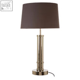 Bronze finished skye table lamp with wide tubular base and dark brown cylindrical fabric shade for cozy lighting