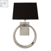 A sleek skye wall light with a polished chrome ring, square backplate, and matte black rectangular shade