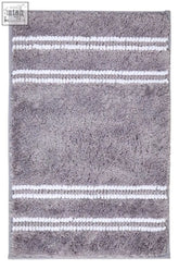Gray plush bath mat with white stripes made of soft textured material perfect as a light grey bath mat
