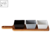 Soiree serving board with light brown bamboo and three square ceramic bowls in black gray and white colors