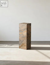 Solara plinth side table made of polished brazilian quartzite stone with natural brown and beige marble pattern