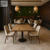 Modern beige upholstered dining chairs with slender wooden legs paired with solid wood dining tables for cafes and restaurants