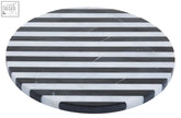 Small black and white marble round cheese board with circular marble coaster featuring black and white stripes