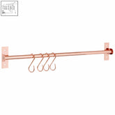 Rose gold metal towel rack with five matching rose gold hanging hooks for stylish gold hanging hooks setup