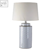 Sorino ceramic table lamp with white base featuring geometric black pattern and matching cream shade on top