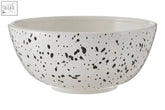 White ceramic speckled salad bowl with black speckles perfect for serving fresh speckled salad meals