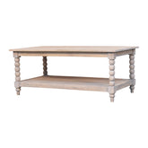 Light gray distressed wood spindle washed coffee table with turned spindle legs and a lower shelf for storage