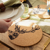 Circular cork place mat with black inked stag head illustration heat resistant and stylish coaster design