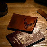 Brown leather card wallet with black engraved stag head design perfect as a stylish leather card wallet
