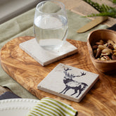 White stone stag single stone coaster with black engraved deer design made of natural limestone and heat resistant