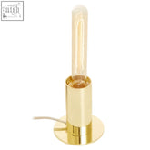 Stockholm table lamp with shiny brass finish and clear vintage-style filament bulb for warm ambient lighting