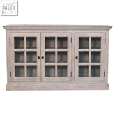 A rustic stone wash triple wooden sideboard with light gray mango wood and triple-glazed glass-paneled doors