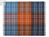 A cozy stormness check pure new wool throw in brick navy with bold plaid in blue orange brown and white accents