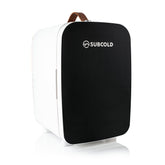 Black and white subcold pro 15l mini fridge with a brown leather handle perfect for small spaces