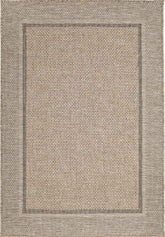 Beige woven summer latte border rug with textured basketweave pattern and subtle border for indoor outdoor use
