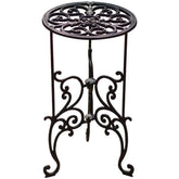 Black wrought iron cast iron garden stand with ornate scrollwork for rustic style potted plants indoor outdoor use