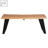 A sleek light-colored acacia wood coffee table with black metal legs featuring a live edge design