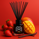 Black glass diffuser bottle with dank mer sweet mangoes label and black reeds filled with sweet mangoes fragrance oil