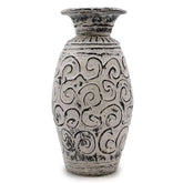 A tall cream lombok ceramic vase with flared rim and black swirling patterns perfect for dry flowers