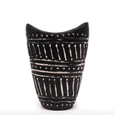 Black ceramic swirls shaped vase with white geometric patterns and dotted accents for dry flowers in chocolate tone