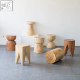 Light-colored wooden takeshi side table stools celebrate natural wood with unique organic shapes and varied grain patterns