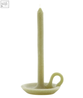 A tall olive candle with a smooth pale green cylindrical body and a curved handle base for easy carrying