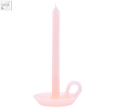 A tall rose candle in blush pink with a slender tapered shape and smooth matte finish perfect for cozy decor