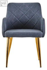 Blue quilted armchair with gold tone metal legs shown from front in dark grey effect angular dining chair style