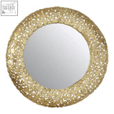 Gold-toned round wall mirror with textured leaf-shaped metal frame featuring pebble effect design