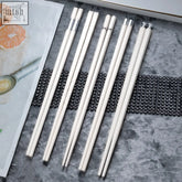 Set of six tetsu chopsticks with clean lines and subtle luxury featuring white sticks and silver-toned metallic ends