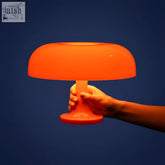 Vibrant orange ambient mushroom desk lamp with smooth translucent plastic body for stylish lighting on your desk