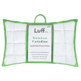 White quilted bamboo paradise pillow with vibrant green border handle and luff bamboo paradise brand label