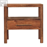 A minimalist caldera bedside stand with honey caramel finish, wooden drawer, sleek brass handle, and open shelf storage