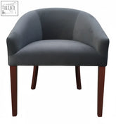 Dark gray velvet oxford tub chair with sleek curved design and rich mahogany legs perfect for stylish seating