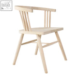 Light-colored wooden armchair with vertical spindle backrest and modern scandi design called the scandi 3 spell chair