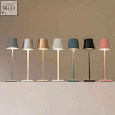 A sleek simplistic wireless led lamp with a minimalist cylindrical shade and slender stem in multiple modern colors