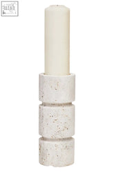 Cream-colored speckled concrete tibor travertine small candle holder with a white cylindrical small candle inside