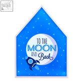 Blue illuminated house shaped led light box with white border featuring to the moon and back design and rocket illustration