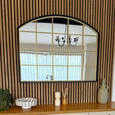 Arched lattice window mirror with black frame and gold metal grid in 95cm by 120cm size for wall decor