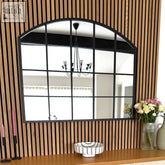 Tomi mirror is a black metal arched lattice window mirror with nine panes measuring 95cm by 120cm
