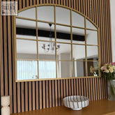 Gold metal arched tomi mirror with lattice window design and rectangular panes sized 95cm by 120cm